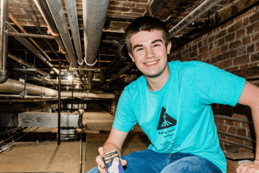 Student in a crawlspace