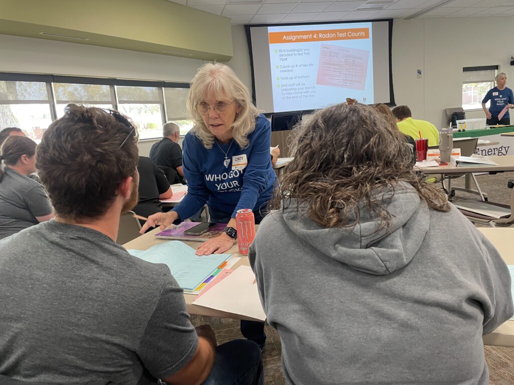 EAIS Radon Rep Cindy Norman provides guidance to school staff during a 2024 radon test training.